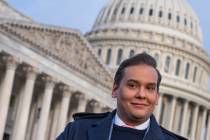 Rep. George Santos, R-N.Y., faces reporters at the Capitol in Washington, early Thursday, Nov. ...