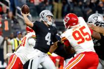 Raiders quarterback Aidan O'Connell (4) throws a pass under pressure from Kansas City Chiefs de ...