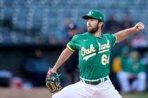 Oakland Athletics pitcher Ken Waldichuk throws against the Chicago Cubs during the first inning ...