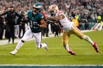 Philadelphia Eagles running back Boston Scott, left, runs for a touchdown past San Francisco 49 ...