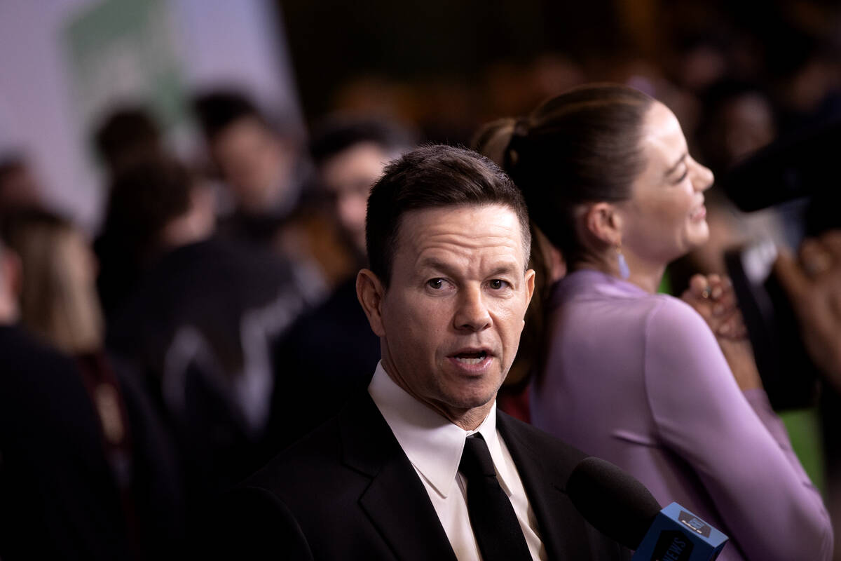 Actor and producer Mark Wahlberg speaks to reporters during a red carpet premiere of Apple Orig ...