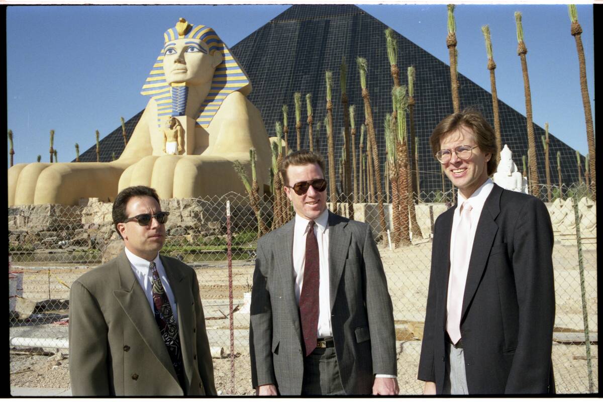 Three architects standing in front of the Luxor Hotel ahead of its 1993 opening. Names include ...