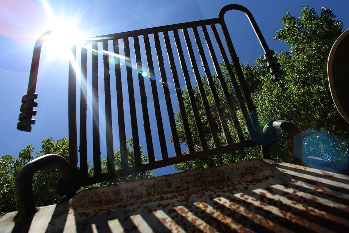 A charcoal grill is seen against the blue sky and a shining sun at Floyd Lamb Park in 2020 in L ...