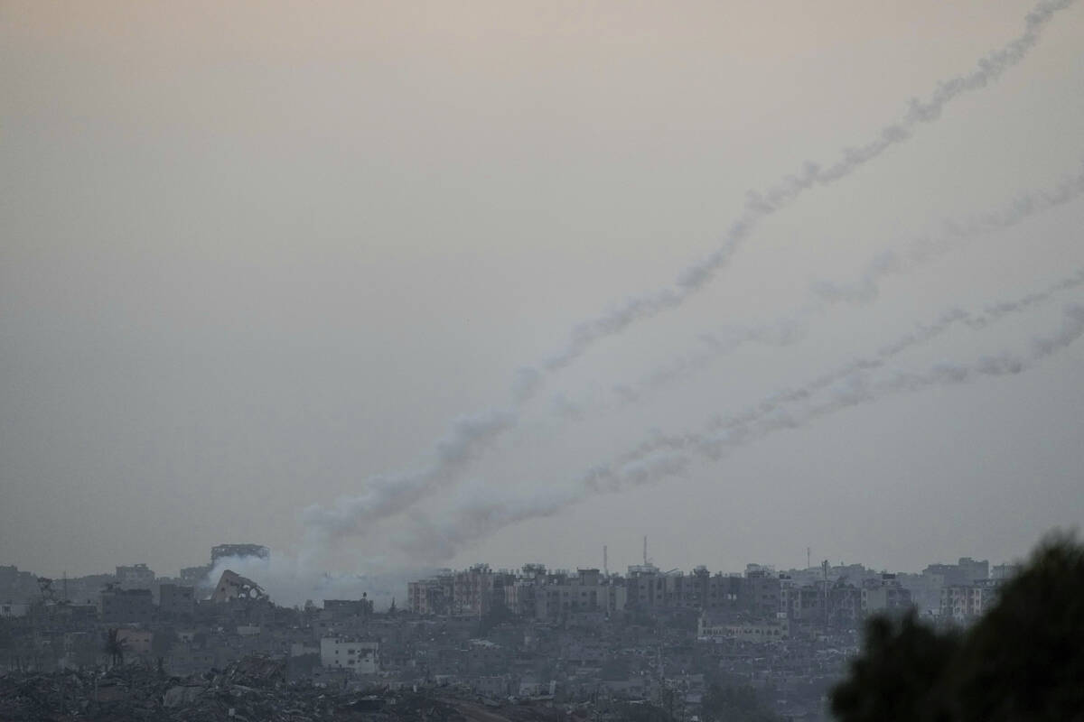 Trails of rockets fired towards Israel from the Gaza Strip, as seen from southern Israel, Satur ...