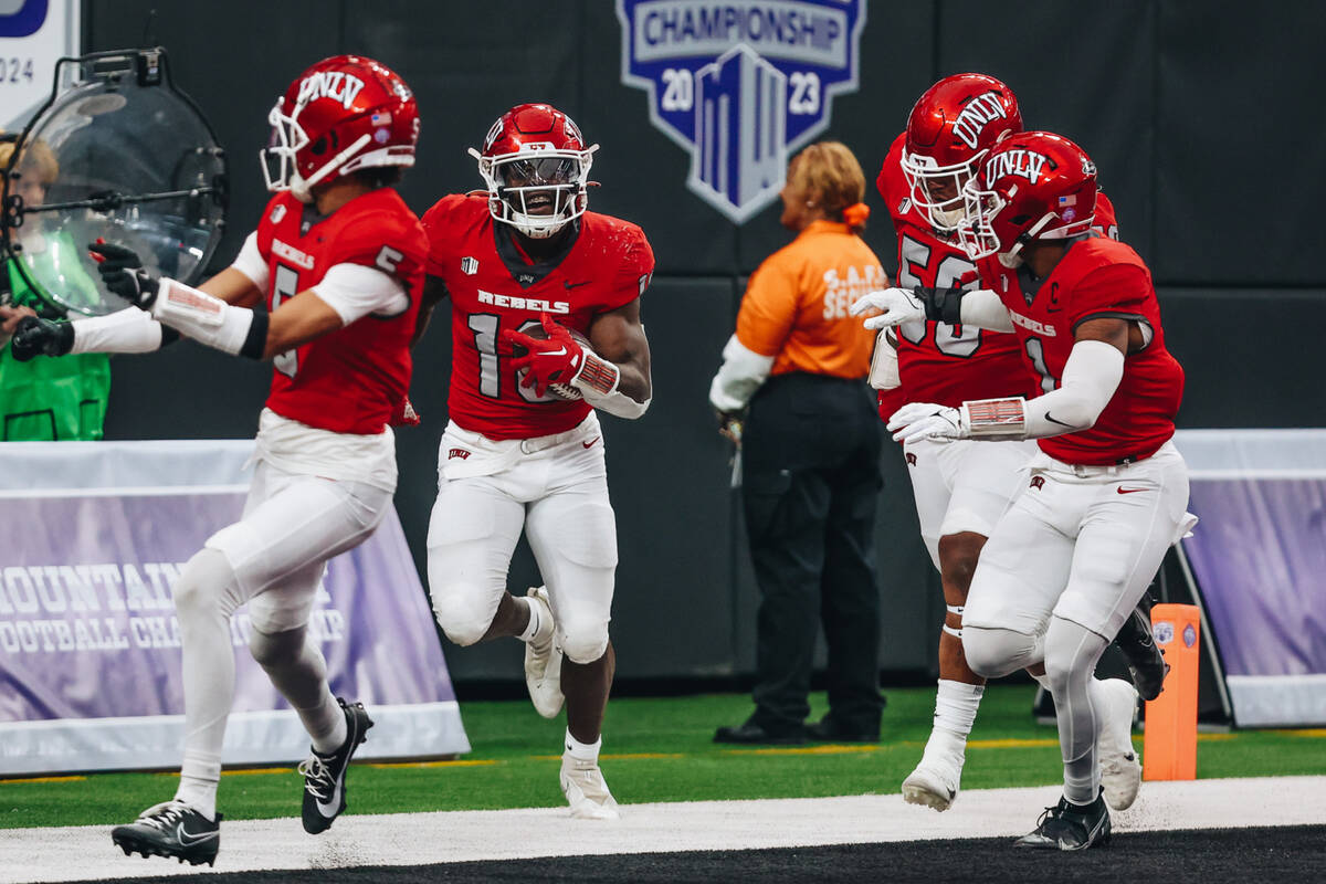 UNLV linebacker Fred Thompkins (10) celebrates a touchdown with his teammates during the Mounta ...