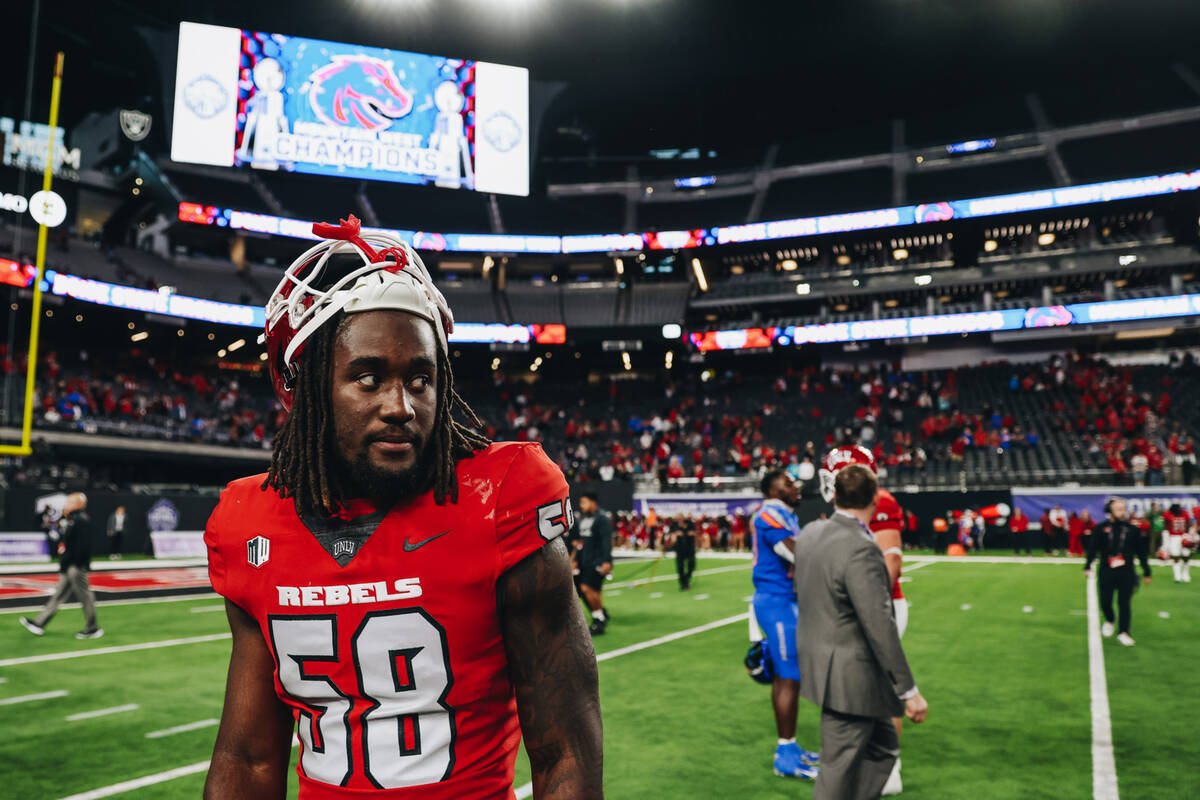 UNLV linebacker Jordan Eubanks (58) watches the Boise State football team celebrate winning the ...
