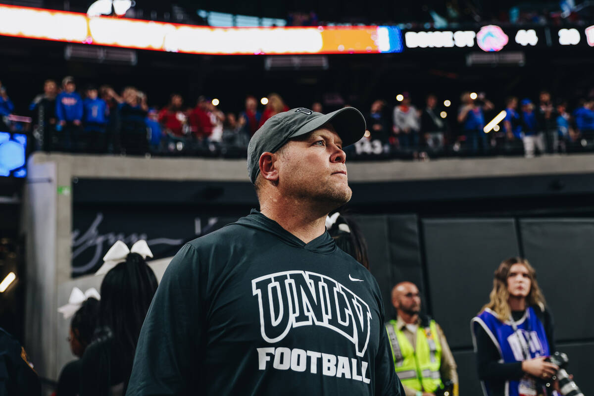 UNLV head coach Barry Odom stands on the field after losing the Mountain West championship game ...