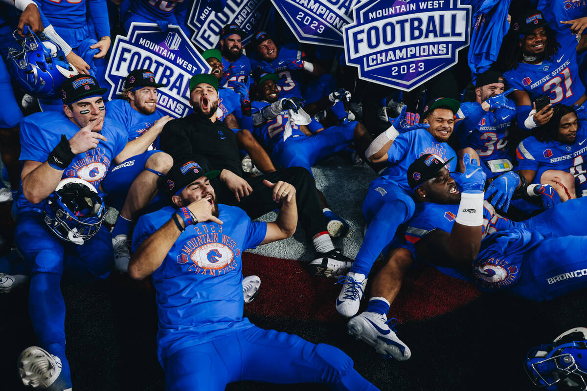 Boise State players celebrate winning the Mountain West championship game at Allegiant Stadium ...