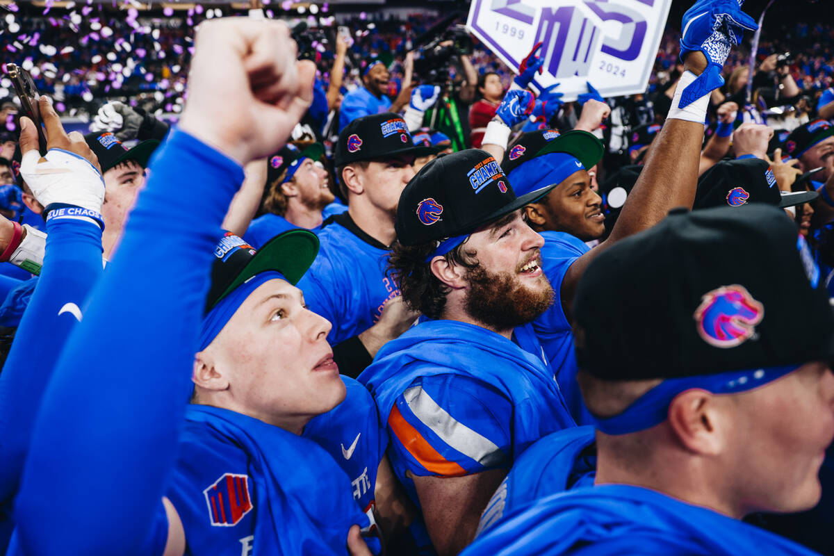 Boise State players celebrate winning the Mountain West championship game at Allegiant Stadium ...