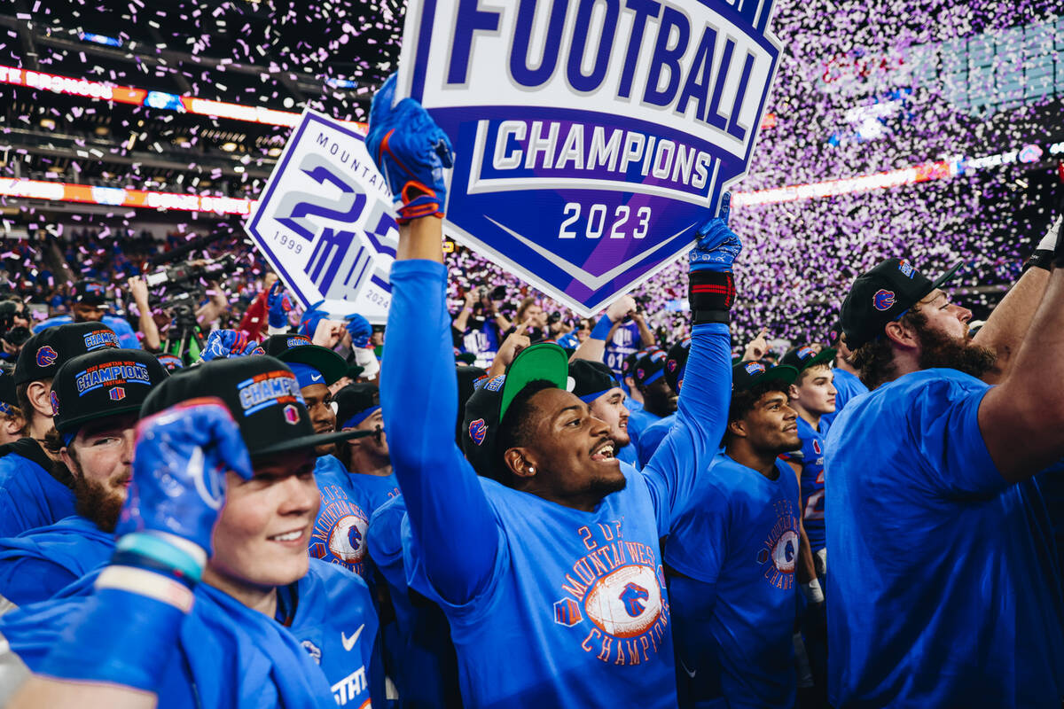 Boise State players celebrate winning the Mountain West championship game at Allegiant Stadium ...