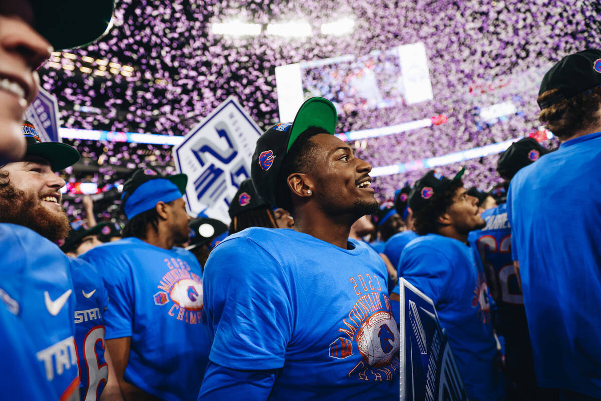 Boise State players celebrate winning the Mountain West championship game at Allegiant Stadium ...