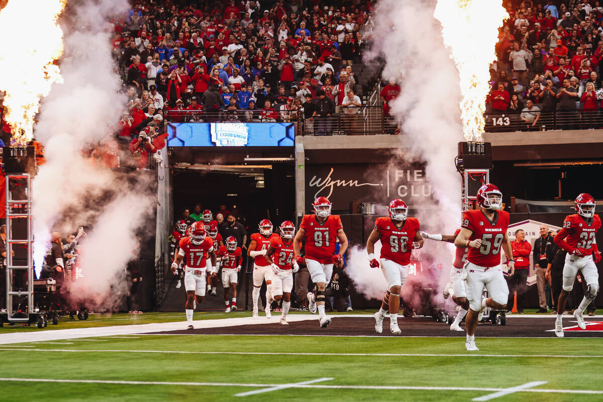 UNLV makes their entrance for the Mountain West championship game at Allegiant Stadium on Satur ...
