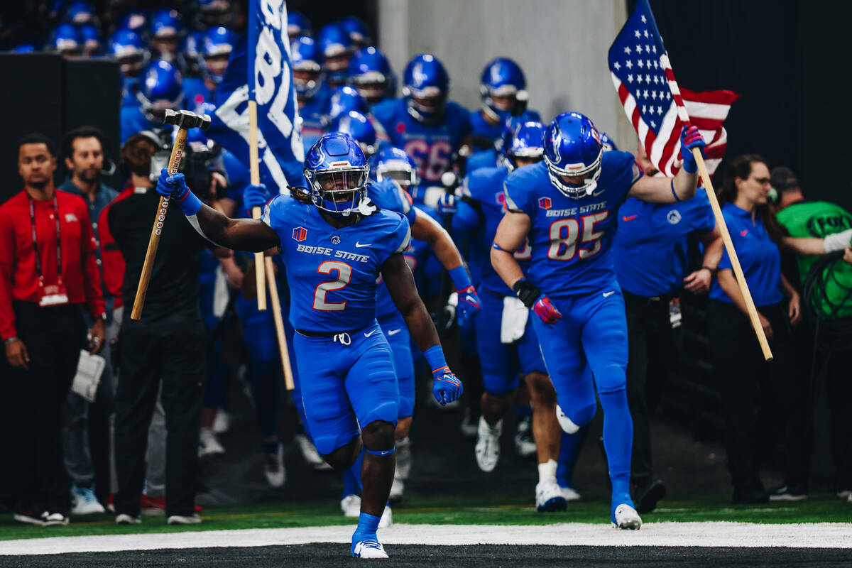 Boise State players run out of the tunnel before the Mountain West championship game at Allegia ...