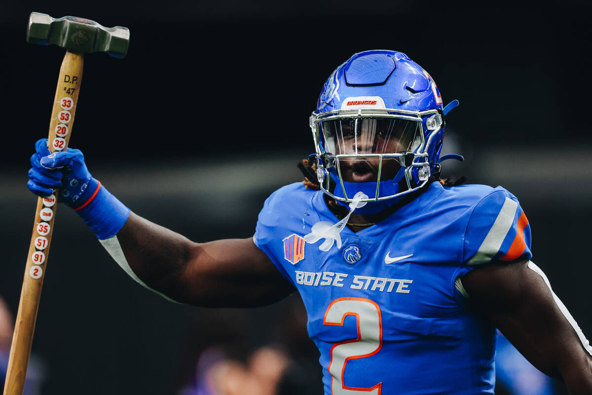 Boise State running back Ashton Jeanty (2) carries a hammer out of the tunnel before the Mounta ...