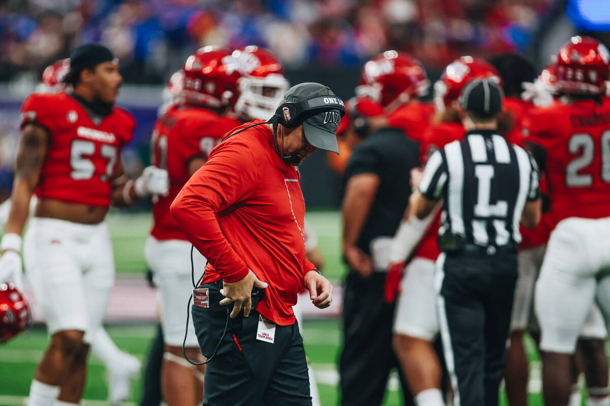 UNLV head coach Barry Odom walks to the sidelines after a time out during the Mountain West cha ...