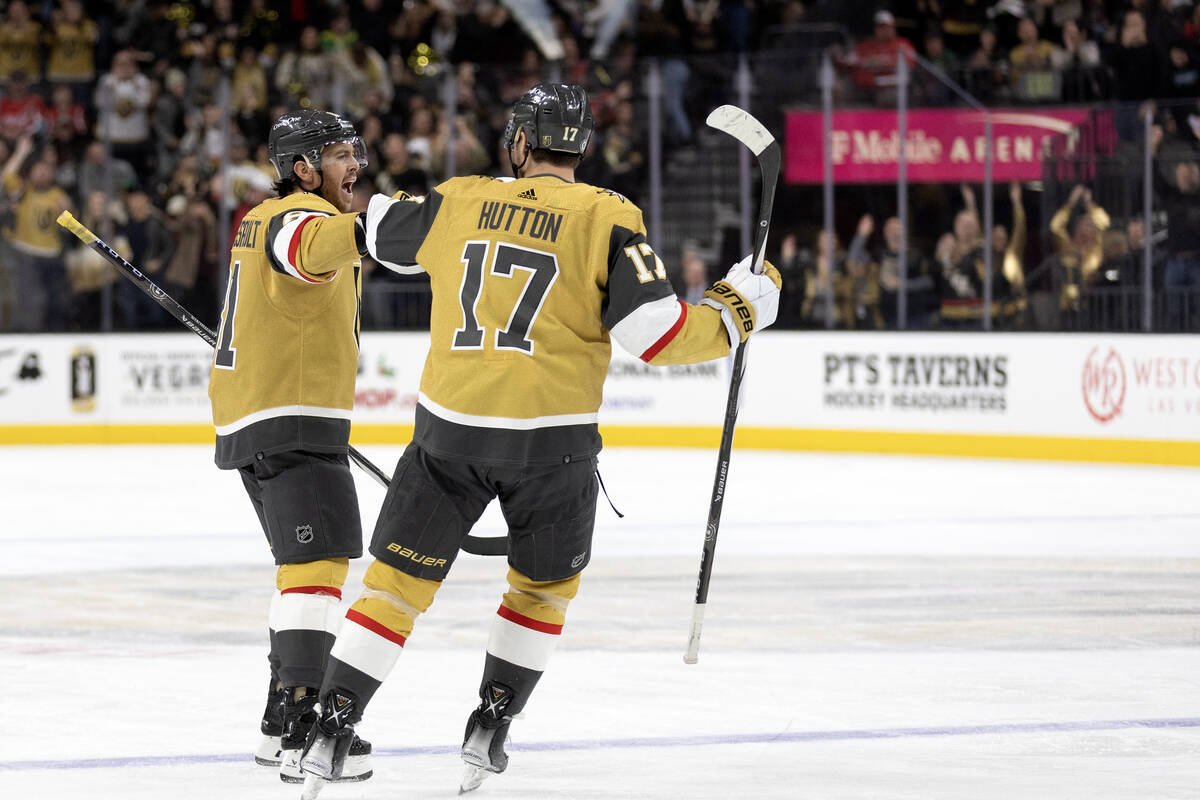 Golden Knights right wing Jonathan Marchessault (81) celebrates his goal with defenseman Ben Hu ...