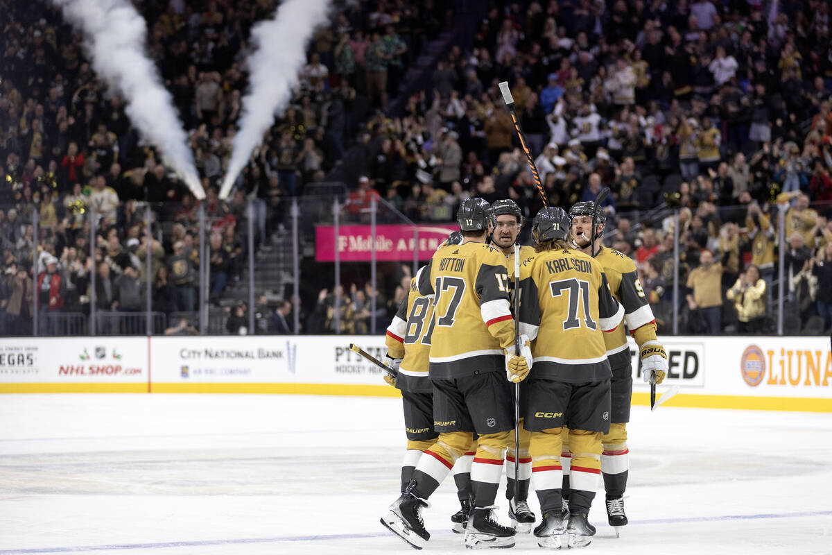 The Golden Knights celebrate their goal during the first period of an NHL hockey game against t ...