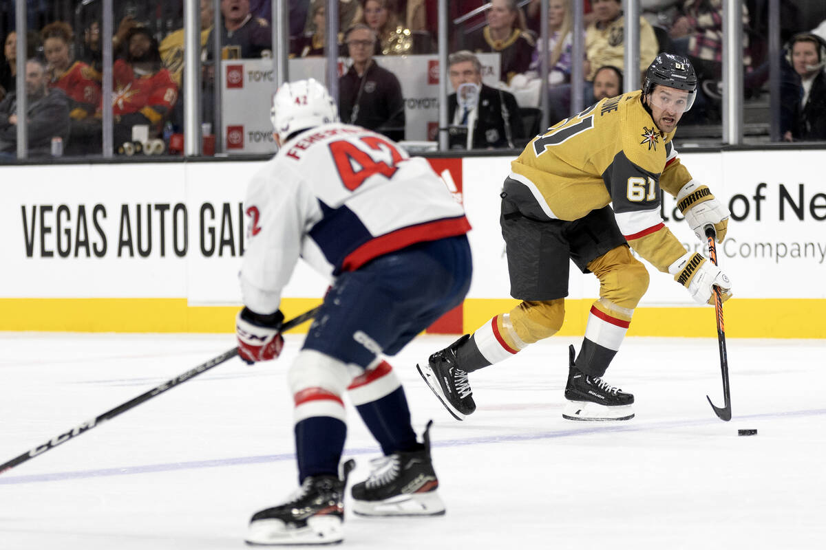 Golden Knights right wing Mark Stone (61) breaks away with the puck against Capitals defenseman ...