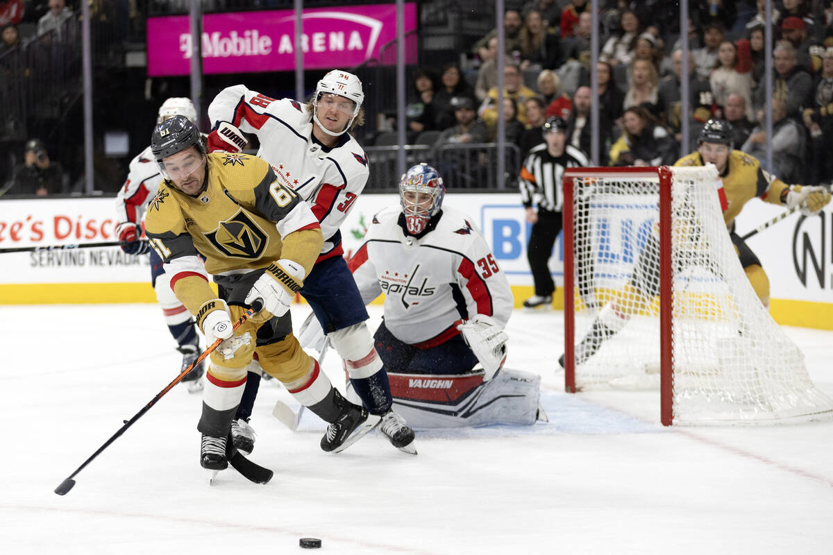 Golden Knights right wing Mark Stone (61) skates for the puck after Capitals goaltender Darcy K ...