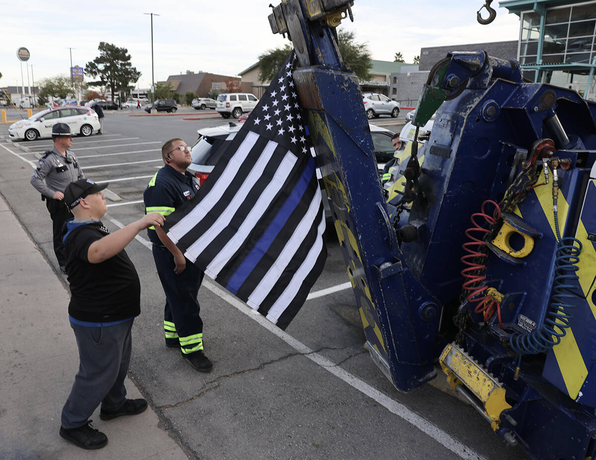 Tow truck operators, Nevada State Police and Capitol Police gather at Dula Community Center in ...