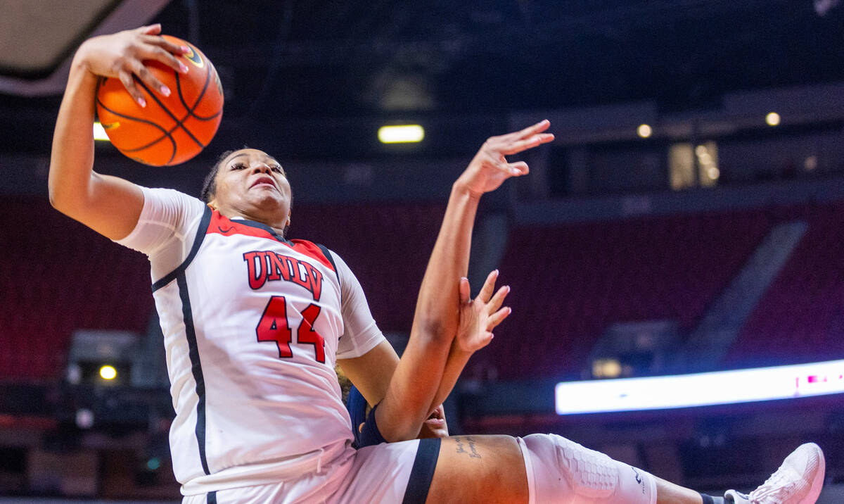 UNLV Lady Rebels forward Alyssa Brown (44) fights for a loose ball against the Arizona Wildcats ...