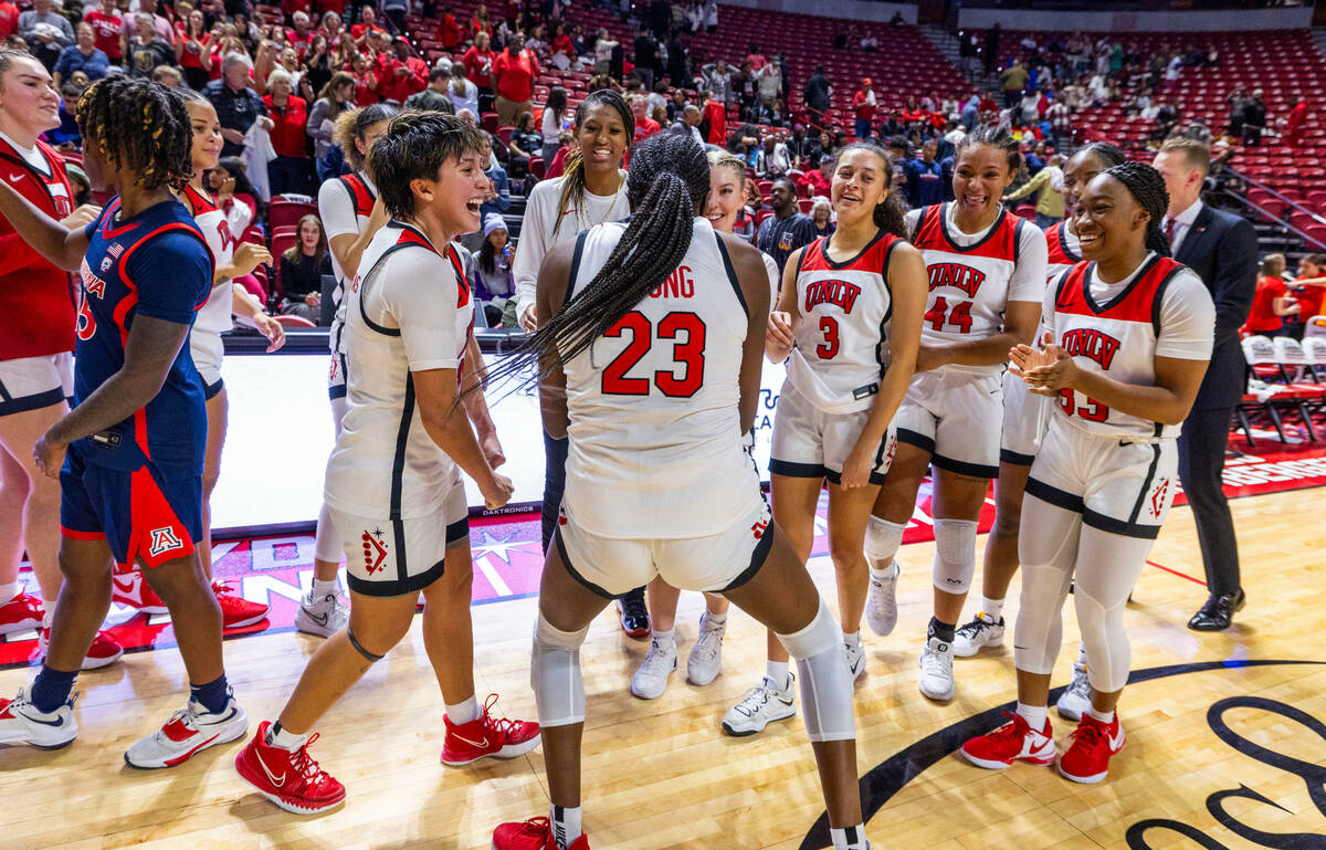 UNLV Lady Rebels center Desi-Rae Young (23) dances to the delight of teammates after defeating ...