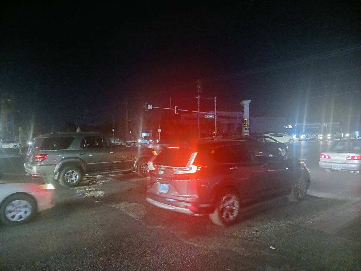 Drivers navigate Desert Inn Road and Eastern Avenue in Las Vegas after the traffic lights went ...