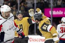 Golden Knights right wing Mark Stone (61) celebrates his goal with center Ivan Barbashev (49) w ...