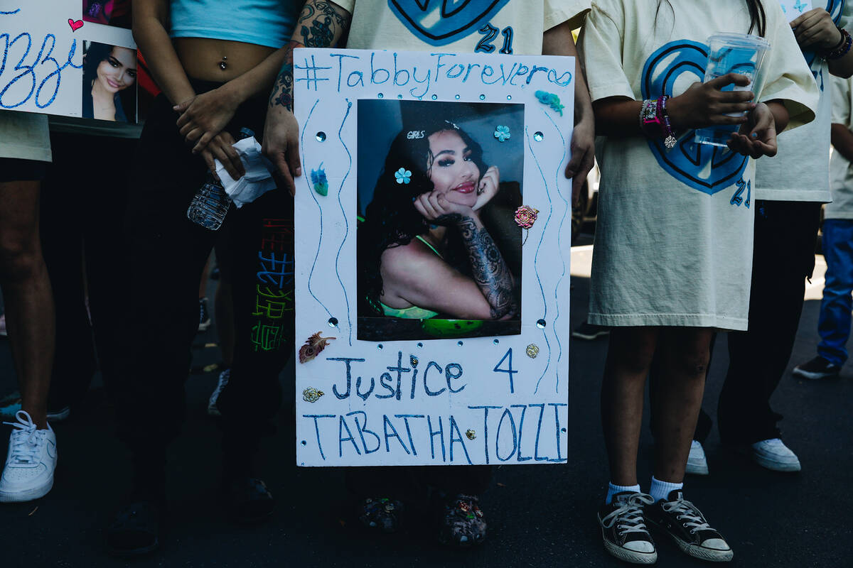 A sign with a photograph of Tabatha Tozzi is seen during a demonstration in her memory at Metro ...