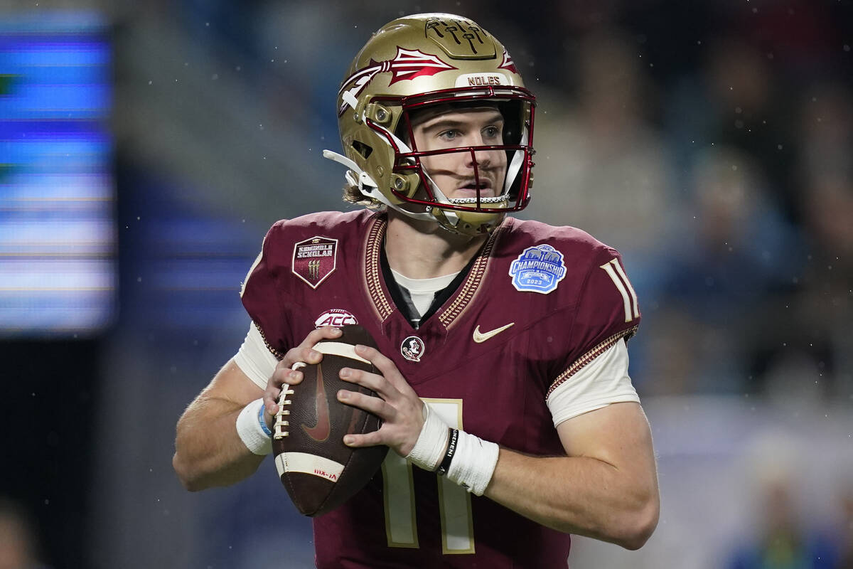 Florida State quarterback Brock Glenn looks for an open pass during the first half of the Atlan ...