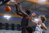 Arbor View’s Pharaoh Compton (5) dunks the ball around Foothill’s Corbin Putnam ( ...