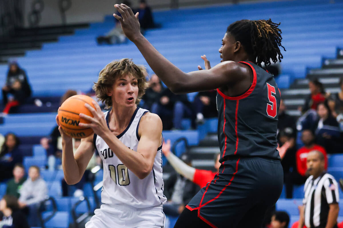 Foothill’s Corbin Putnam (10) attempts to move the ball past Arbor View’s Pharaoh ...