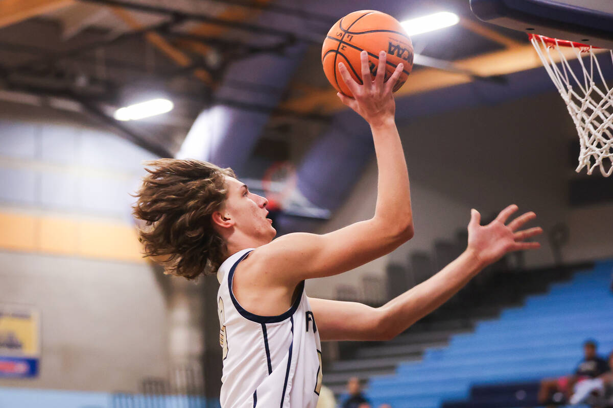 Foothill’s Corbin Putnam (10) goes in for a layup during a basketball game between Footh ...