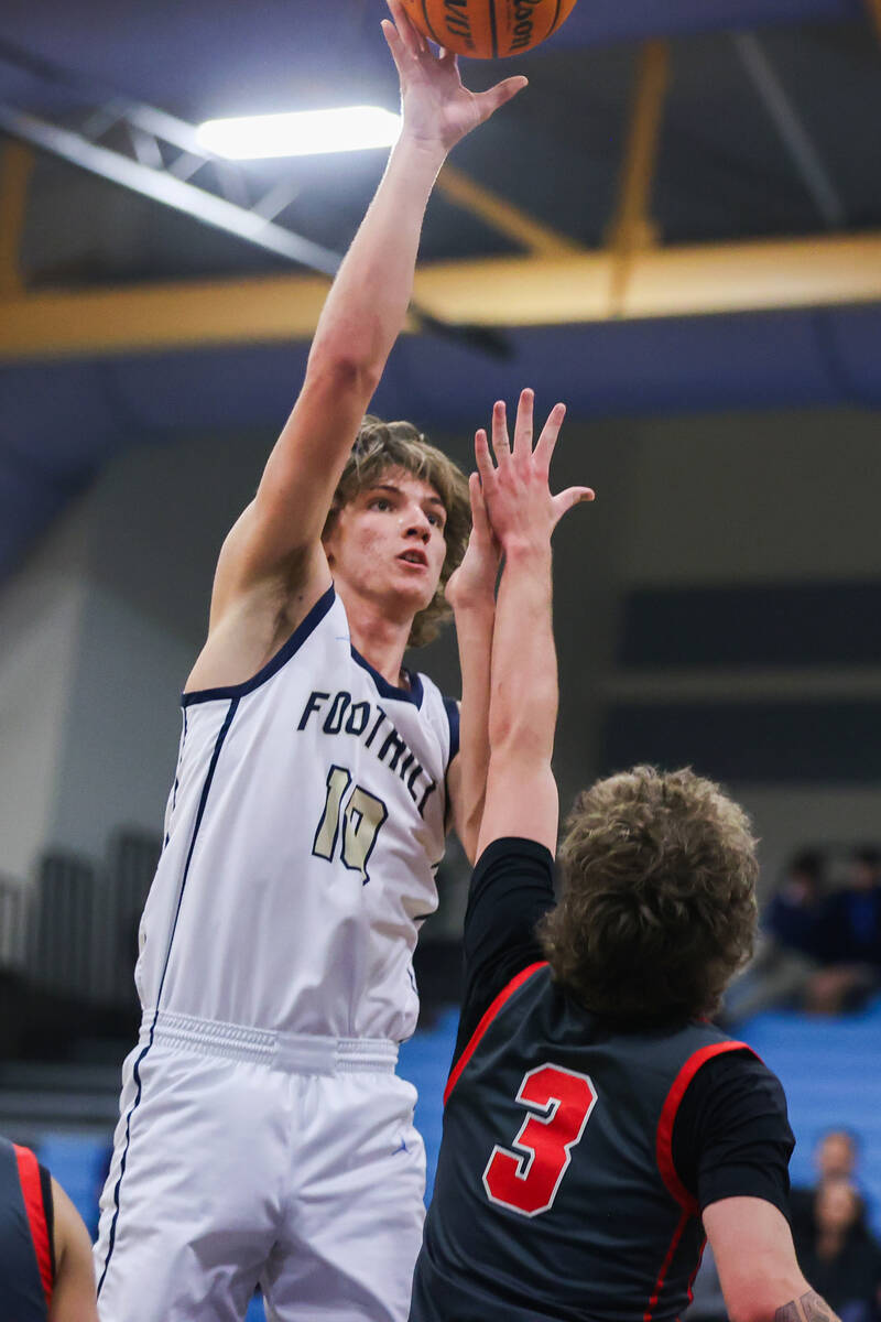 Foothill’s Corbin Putnam (10) takes a shot during a basketball game between Foothill Hig ...