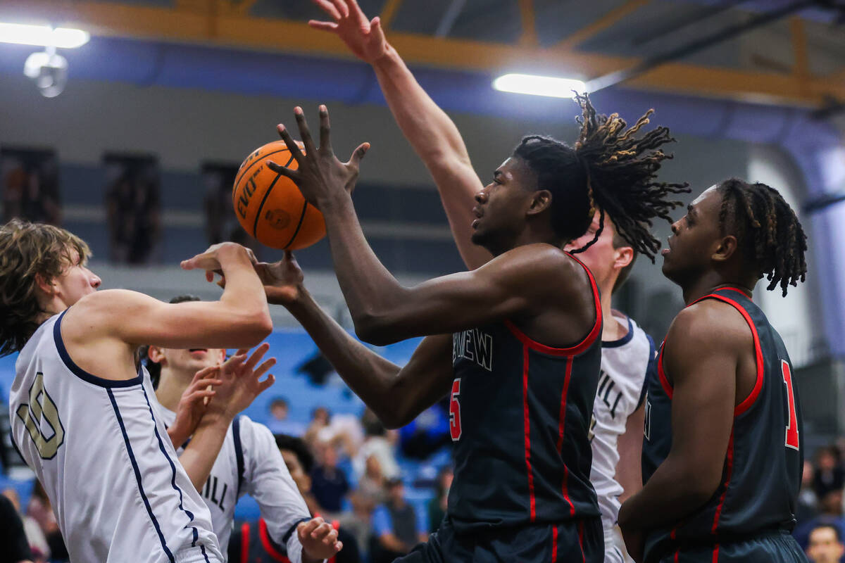 Arbor View’s Pharaoh Compton (5) rebounds the ball during a basketball game between Foot ...