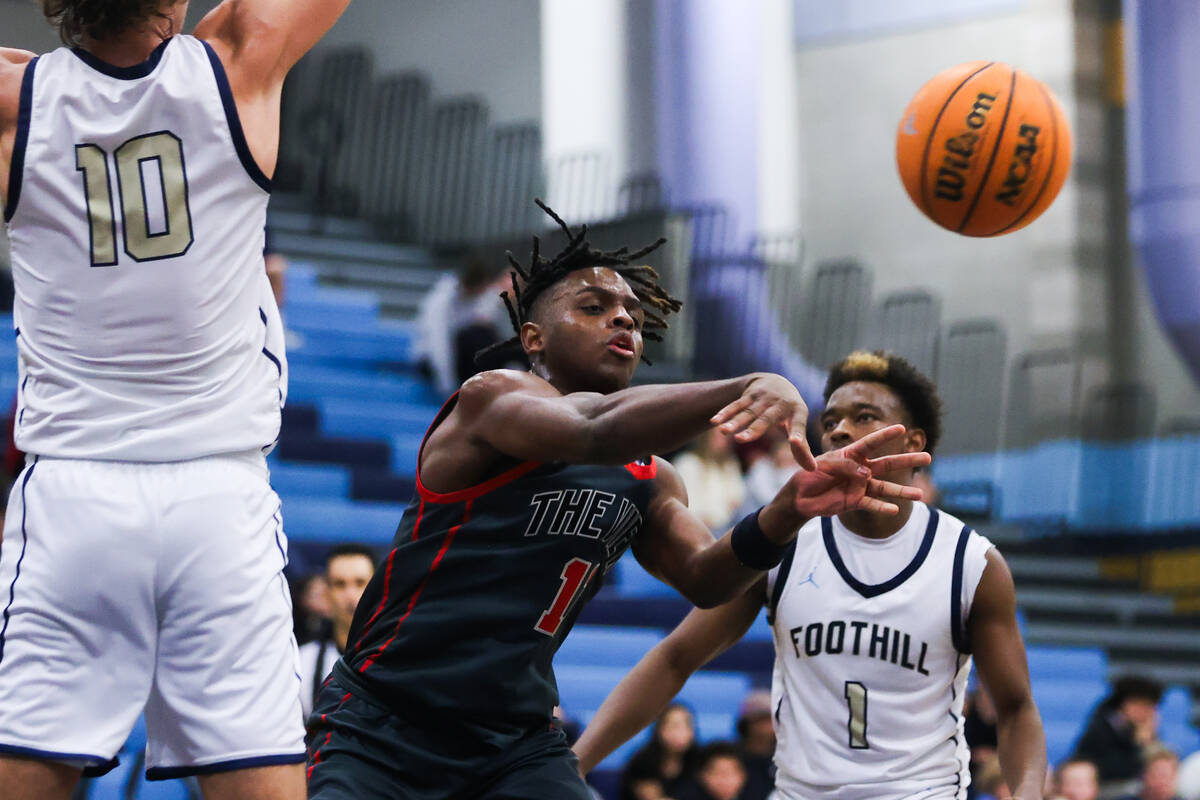 Arbor View’s Brian “Chef” Townsend (11) passes the ball during a basketbal ...