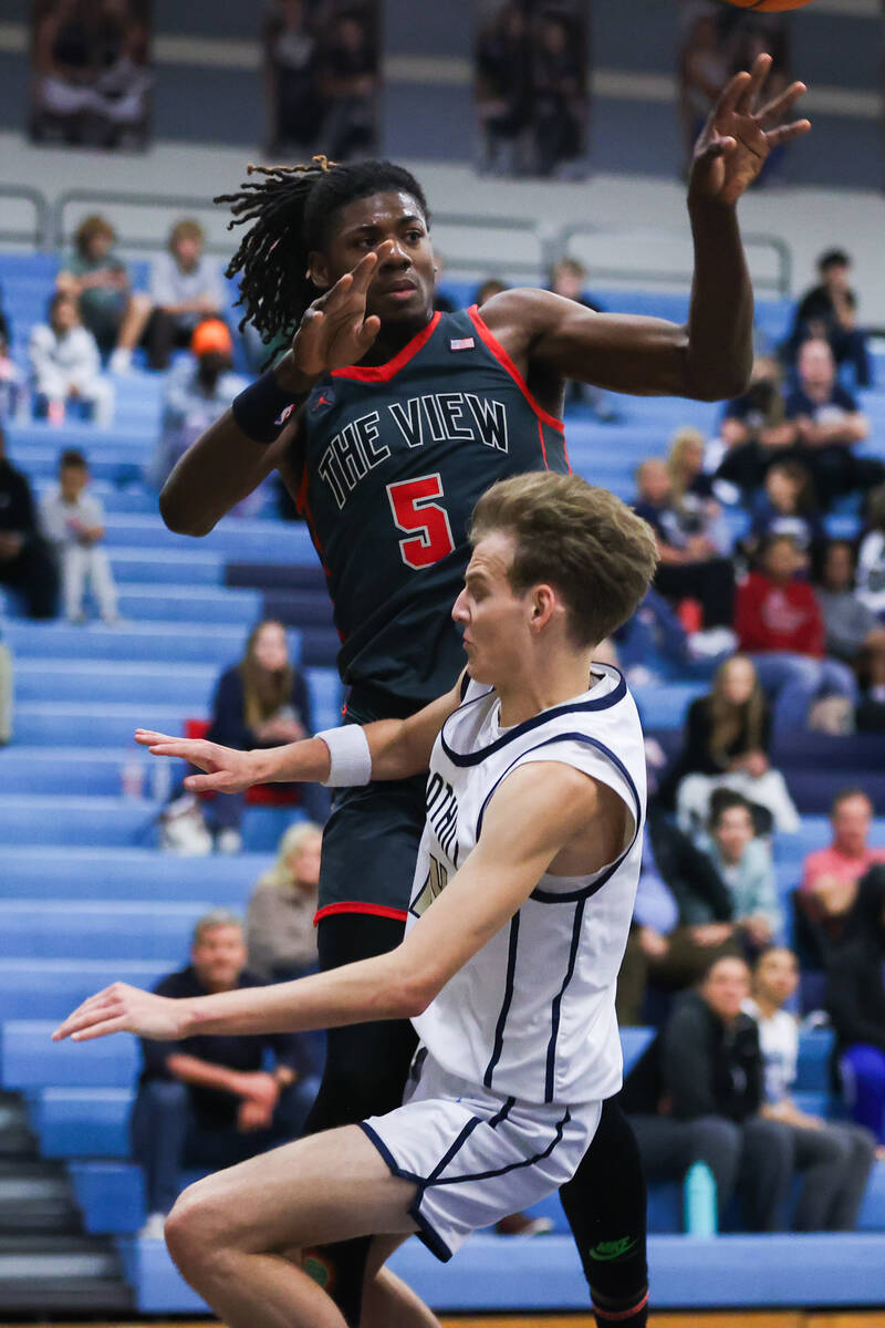 Arbor View’s Pharaoh Compton (5) fouls Foothill’s Christopher Natale Jr. (14) dur ...