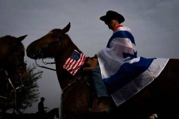 Family and supporters of Israeli hostages held by Hamas in Gaza gather for a horse ride calling ...
