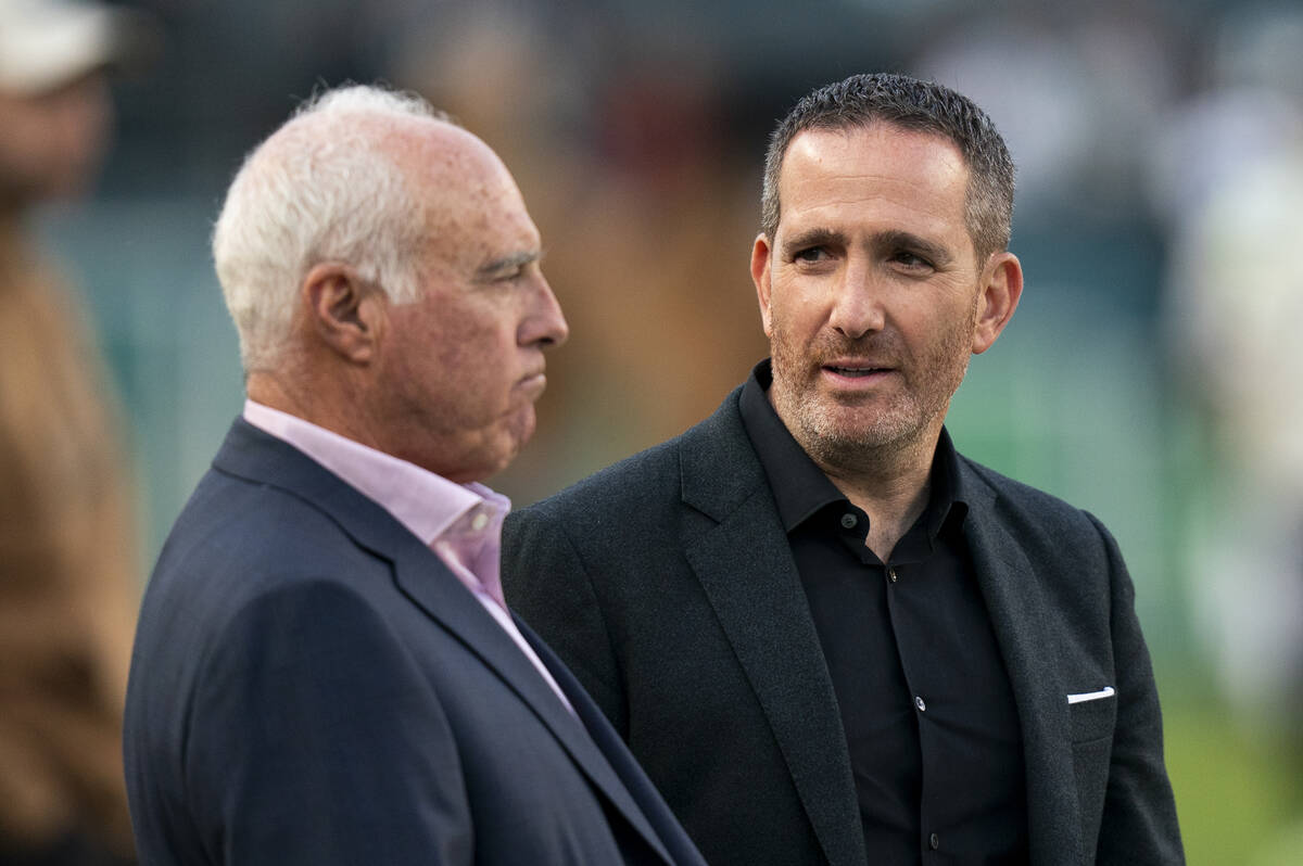 Philadelphia Eagles general manager Howie Roseman, right looks on with owner Jeffery Lurie, lef ...