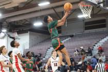 Mojave's C.J. Shaw (3) lays up the ball against Las Vegas during the first half of a basketball ...