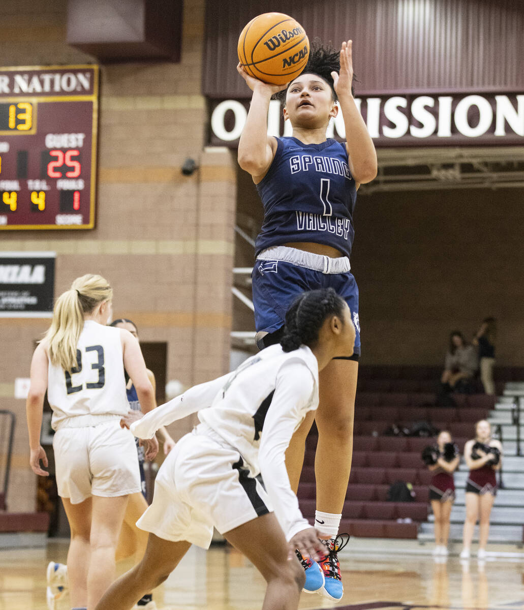 Spring Valley's high Mia Ervin (1) shoots over Faith Lutheran's Tamiah Harrison (4) during the ...