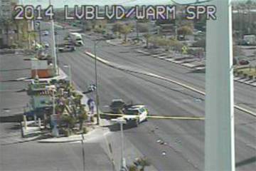 Police investigate a crash involving a pedestrian Tuesday, Dec. 5, 2023, at East Warm Springs R ...