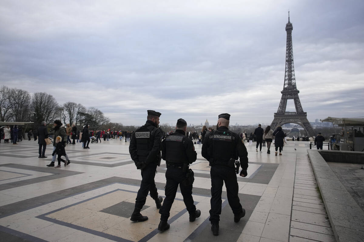 French gendarmes patrol the Trocadero plaza near the Eiffel Tower after a man targeted passersb ...