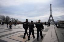 French gendarmes patrol the Trocadero plaza near the Eiffel Tower after a man targeted passersb ...