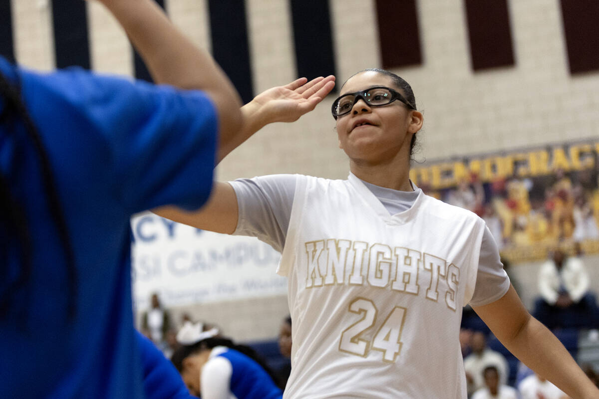 Democracy Prep’s Brooklyn Williams (24) is announced in the starting lineup during a gir ...