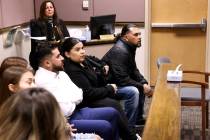 Family members of four young teenagers arrested in connection with the fatal group beating of a ...