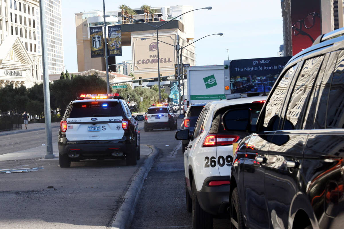 Las Vegas police pass stopped traffic on Flamingo Road near the Strip in Las Vegas Wednesday, D ...