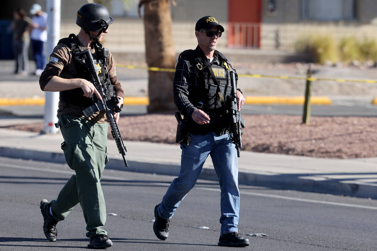 Police patrol on Harmon Avenue near Maryland Parkway after a shooting on the UNLV campus in Las ...