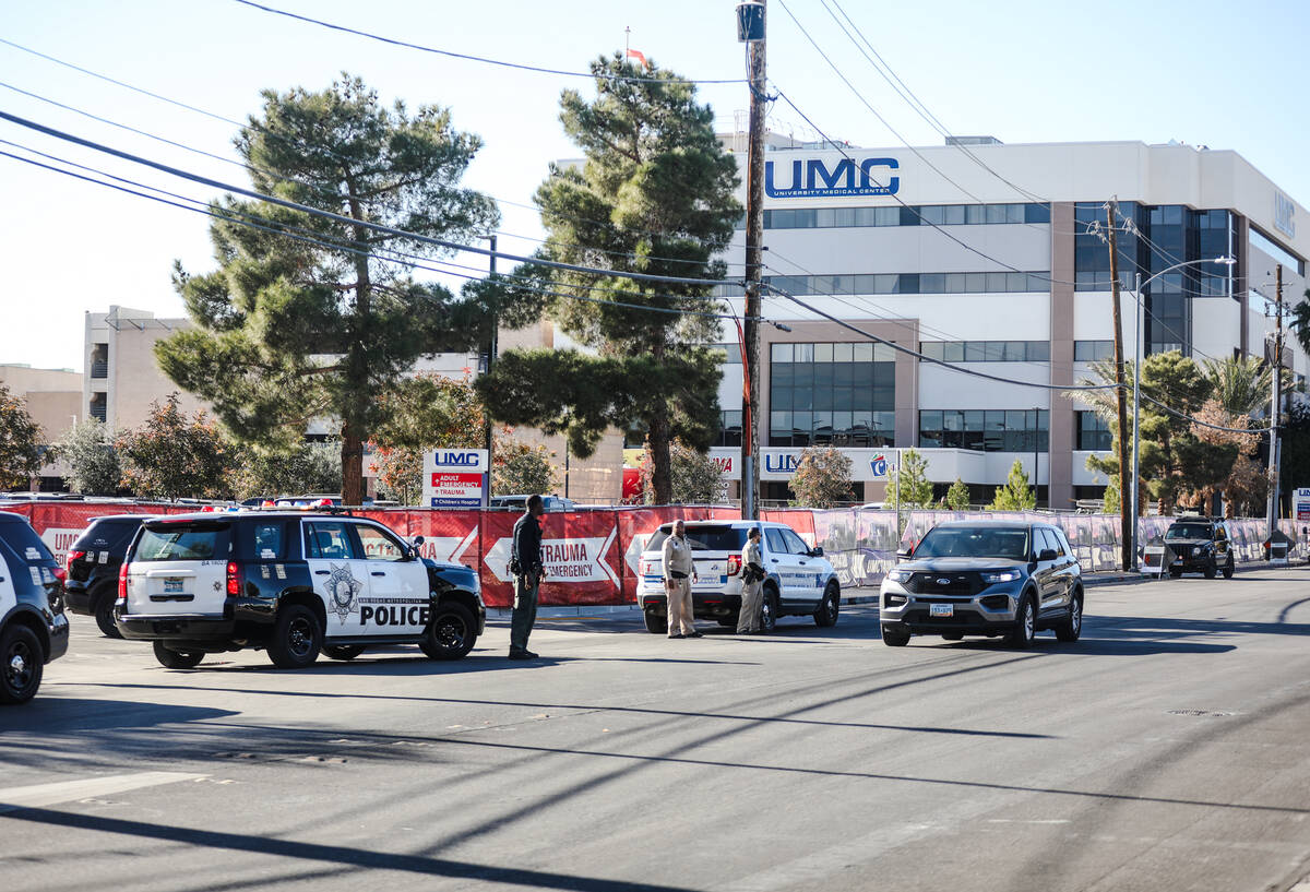 Police gather outside UMC following an active shooter at UNLV in Las Vegas, Wednesday, Dec. 6, ...