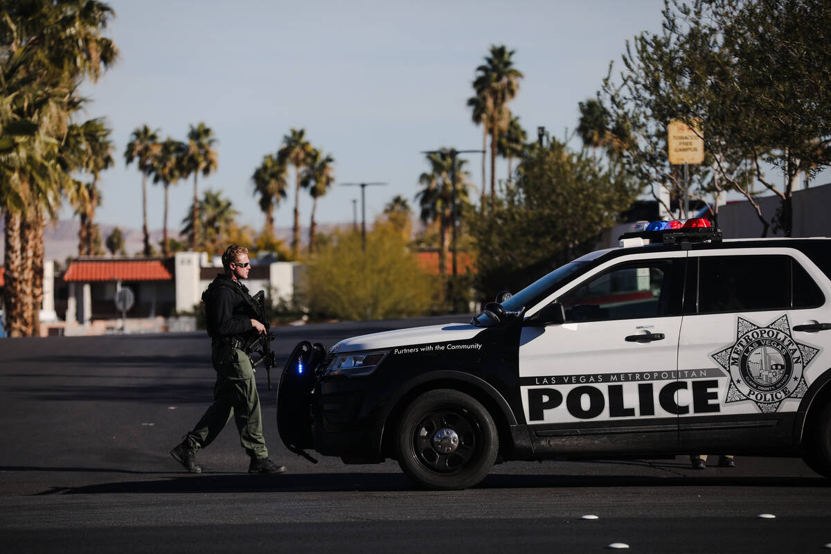 Police are seen at Sunrise Hospital and Medical Center after an active shooter event at UNLV, i ...